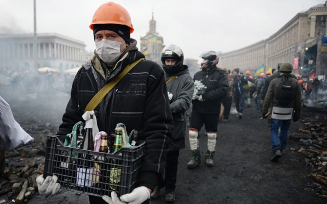 Protesters carry molotov cocktails. Jeff J Mitchell:Getty Images