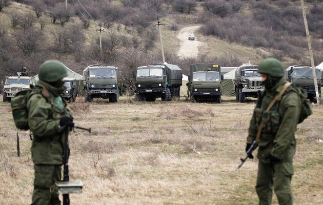 Military vehicles, believed to be property of Russian army, are seen near the territory of a Ukrainian military unit in the village of Perevalnoye outside Simferopol March 2, 2014. Image by: VASILY FEDOSENKO / REUTERS