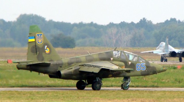 Ukrainian Air Force Su-25UB with two MiG-29s 9-13 in background