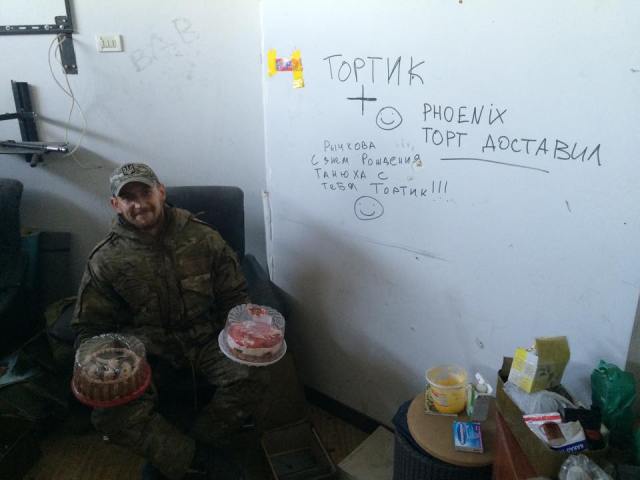 On the wall: "Phoenix delivered cake" and a birthday wish for one of them.