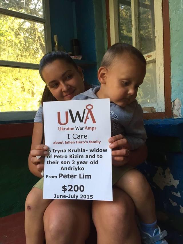 Petro Kizym's widowed wife Iryna Kruhla and 2 year old son Andriyko in their home in Cherkasy region. Petro Kizim was 24 years old on March 5, 2015 sitting in a truck with his friend and neighbour Oleksandr Behersky when a deadly strike killed Petro on the spot. Iryna and Andriyko became one of two families supported by the I CARE program in June 2015.
