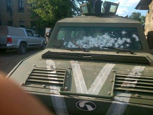 Ukrainian APC "Cougar" managed to withstand this many precise shots to its bulletproof windshield during separatist ambush. Source