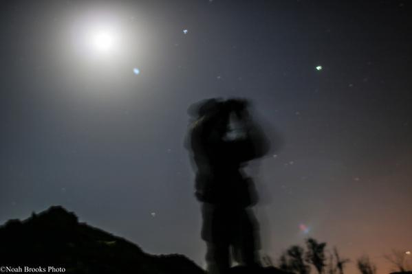 A Ukrainian soldier keeps watch over enemy positions. Photo: Noah Brooks 
