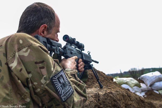 An Azov Battalion sniper takes aim on the front line. Photo: Noah Brooks. Source: https://twitter.com/NoahBrooks99/status/625456092940734465