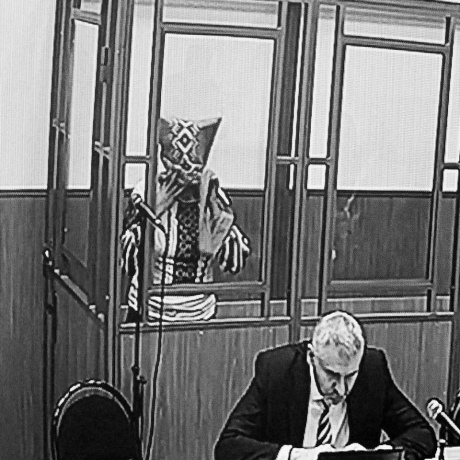 Savchenko with a bag on her head asking the witness to identify her. Photo: Anton Naumlyuk