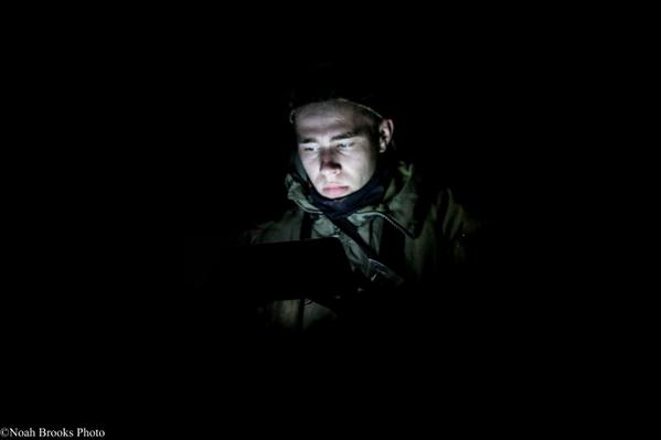 Ukrainian volunteer in the trenches. Photograph by Noah Brooks. Source