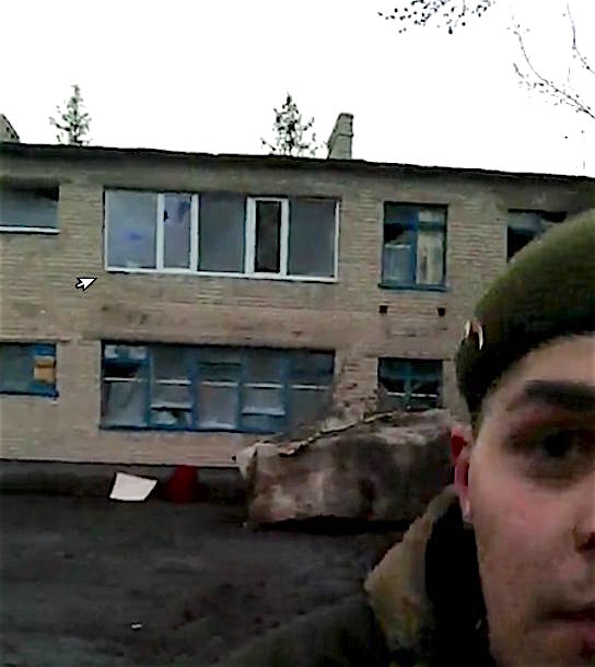 Putin's orcs hide a BMP beneath the wall of a school turned into a stronghold base in Zaitseve, March 17, 2016. (1/2) Photo.